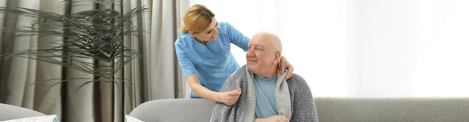a female caregiver with an elderly man